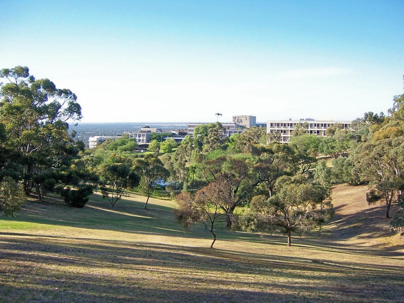 View of Flinders University main campus with central plaza and lakeside area visible